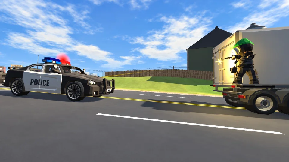 A robber on a box truck as a police car arrives.